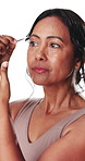 Mature woman, tweezer and grooming with eye brows in studio for facial on a white background. Female person, model or plucking with beauty tool or cosmetics for epilation, hair removal or trimming