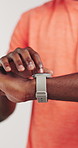 Man, hands or smart watch in studio for exercise, tracking heart rate or fitness progress app. Person, scroll or check time for workout results, wellness and monitor step counter on white background.