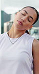 Stretching neck, runner and woman in city for exercise, training and ready for workout outdoor. Sports, fitness and person with warm up to start running for wellness, endurance and health in morning