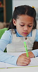Development, education and writing with girl student in home study for growth or learning. Homework, knowledge and notebook with child pupil at desk in apartment for academics or school assessment