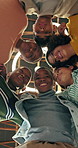 Students, low angle and children huddle for teamwork, talking or support for education. Girls, boys and group together at school for learning, discussion and happy friends with solidarity below