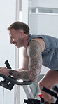Laughing, man and exercise with bike, spin class or training for body strength, wellness and fitness. Gym, endurance and person on machine for workout routine, mobility and active for health goals