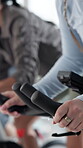 Spin class, exercise and hands with bike, fitness and training routine for physical health benefits. Gym, cycling and people on machine for body strength, active or cardio for wellness or endurance