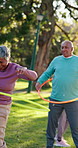Hula hoop, fitness and group of senior friends in park for workout, health or wellness in retirement. Training, equipment and elderly people with exercise for balance, movement or class in nature.