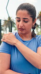 Hurt, athlete and woman with shoulder pain, court and discomfort of muscle tension or sports injury. Outdoor, tennis player and person with joint inflammation, pressure or sore with training accident
