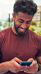 Fitness, typing and happy man on court with phone, funny message or exercise post on social media. Smile, tennis and athlete outdoor with mobile, wellness chat or virtual tutorial on training break.