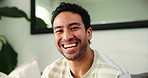 Laugh, sofa and face of man in home to relax, resting and enjoy free time on weekend. Apartment, living room and portrait of person with smile, happy and chill on couch for calm, wellness and peace