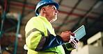 Distribution, low angle or old man in warehouse with tablet, inspection or stock control in shipping industry. Logistics, ppe or operation clerk in depot with tech, cargo or checklist in supply chain
