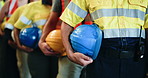 Hands, row and people with helmet for construction safety, site inspection and industry protocol. Line, employees or waiting with hard hat of quality control, workplace compliance and maintenance ppe