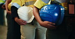 Hands, row and people with helmet in factory safety, site inspection and industry protocol. Line, employees and waiting with hard hat for quality control, workplace compliance and maintenance ppe
