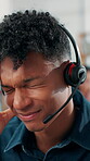 Headache, stress and man in office with headset, frustration or overwhelmed in call center. Telecom, pain or consultant in agency with migraine, burnout or communication fail in customer service.