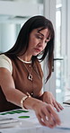 Documents, reading and businesswoman in office for finance review with budget planning for company. Paperwork, research and female financial manager with investment reports for analysis in workplace.