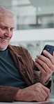 Office, businessman and laugh with phone for chat, online communication and message to contact. Smile, mature person and consultant with reading for mobile app, social media and service to client
