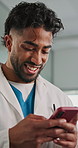 Doctor, man and laughing with phone in clinic for telehealth, funny patient and healthcare results. Health professional, employee and happy with smartphone in hospital for medical report and research
