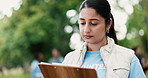 Clipboard, volunteer or woman in park, charity event or community service with checklist. NGO project, documents or person with planning, nonprofit sign up or inventory for donations or registration