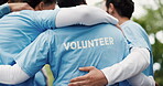 Volunteer, hug and people outdoor with huddle for NGO support, eco project or nonprofit service. Back, team or embrace in nature for social responsibility, climate change initiative and charity work.