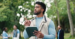 Tablet, man and volunteer outdoor with nonprofit for social responsibility, ngo or charity event. Thinking, nature and male person with digital technology for checklist for community outreach in park