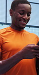 Fitness, typing and black man at court with phone, funny message or exercise post on social media. Happy, padel and athlete outdoor with tech, wellness chat or virtual tutorial on training break.