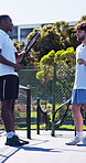 Fitness, team or men in tennis court with conversation, bonding or sports advice for training match. Partner, padel or athlete outdoor with racket, discussion or motivation in performance tips.
