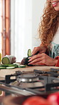 Hands, dance and cut cucumber for cooking, healthy diet or organic ingredients in kitchen. Music, chopping board and happy woman with vegetables for meal prep, vegan nutrition or natural food in home