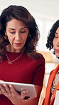 Creative, discussion and women with tablet, office and planning for project with research on website. Reporter, manager and feedback for woman, proofreading and collaboration for story in newsroom
