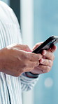 Typing, business or hands in office with mobile, message update or online communication on social media. Digital, bokeh or employee in agency with phone, internet search or connection on email app.