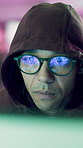 Hacker, glasses and cyber attack in basement with tech, network breach and ransomware in internet fraud. Night, man and computer in system hacking with spyware, dark web and eyewear for online scam.