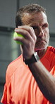Fitness, padel and man in gym with serve, practice and exercise in training match. Tennis workout, mature and male person in studio with equipment, game endurance and ball control in sports hobby.