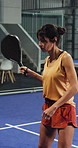 Padel, racket and woman with training, exercise or serve technique with challenge. Mature person, tennis player or athlete with wellness, practice or sports game with fitness, workout or coordination