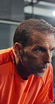 Padel, court and man on break, tired and thinking of tournament, exhaustion and burnout after match. Athlete, breathing and mature person with fatigue, fitness and reflection for sport competition