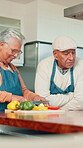 Kitchen, senior couple or cutting vegetables for cooking, meal preparation or bonding in retirement. Elderly people, healthy food and chop ingredients for dinner, conversation and nutrition in home