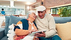 House, relax and old couple with love, tablet and online comedy with smile, app and relationship. Happy, mature man and senior woman on couch, tech and funny video with retirement, joke and laughing
