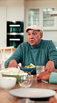 Lunch, thanksgiving and talking with old man in dining room for nutrition, bonding and festive gathering. Health, holiday season and food with people eating in family home for reunion, relax and meal
