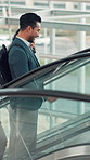 Conversation, escalator and tablet with business people in airport together for planning or travel. App, commute and international trip with happy employee team speaking in terminal for work strategy