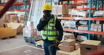 Logistics, radio or black man in warehouse with package, communication or inventory management in supply chain. Feedback, trolley or loader in depot with tech, ppe or cargo update for distribution.