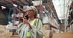 Woman, logistics and talk with phone call in warehouse for online order, shipping feedback and inquiry. Mature person, mobile and discussion for inventory, contact supplier and chat for distribution