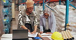 Business women, warehouse or laptop with documents for supply chain deal or construction in depot. Female people, employees or colleagues with paperwork or computer for building renovation in storage