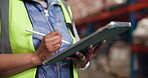 Hands, person and writing with tablet in warehouse for inventory, supply chain and schedule delivery. Worker, stylus and digital to confirm shipping, check stock and quality control for distribution