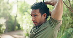 Man, fitness or stretching with arm in nature for workout preparation, exercise or outdoor training. Active, male person or runner getting ready with warm up for physical activity in forest or woods