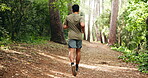 Fitness, back and man in forest with running, cardio exercise or training on international trip. Space, sports goal or athlete in nature with jog, wood trail and endurance workout in Costa Rica.