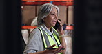 Mature woman, phone call and logistics at warehouse with inventory management, contact and supply chain. Person, smartphone and conversation with shipping, stock and communication at storage plant