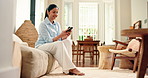 Smile, woman and typing with phone on sofa for online comment, social media post or web browsing. Relax, person or happy with smartphone in home for text message, app download or internet dating site