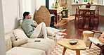 Sofa, couple and hug with love for bonding, chat together and healthy relationship in living room. Happy people, man and woman or partner for connection, smile or commitment with marriage in home