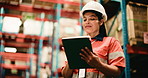 Woman, typing or inspection in warehouse with tablet, inventory management or quality control report. PPE, person or scroll in wholesale factory with tech for logistics, distribution or shipping plan