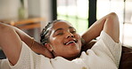 Smile, relax and sofa with black woman in home for mindfulness, self care and comfortable. Happy, satisfaction and peace with female person in apartment for stress relief, calm and weekend break