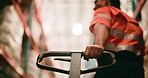 Trolley, handle and hand of worker in warehouse for cargo, supply chain or freight delivery. Distribution, pallet jack and male logistics employee with quality assurance for shipping in factory.