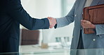 Business people, shaking hands and meeting in office with finance report, budget review or statement. Accountant, welcome and handshake with deal for financial audit or company performance evaluation