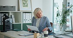 Mature woman, documents and review at office with budget, report or proposal at investment company. Person, broker and advisor with computer, admin and paperwork for market research at finance agency