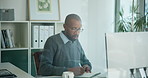 Business, writing and black man in office on computer for finance report, online proposal and research. Corporate, glass and person with notebook for investment decision, financial review or planning