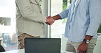 Laptop, business men and handshake in meeting for agreement, negotiation and deal. Computer, team and shaking hands in office for partnership collaboration, discussion or thank you with mature mentor